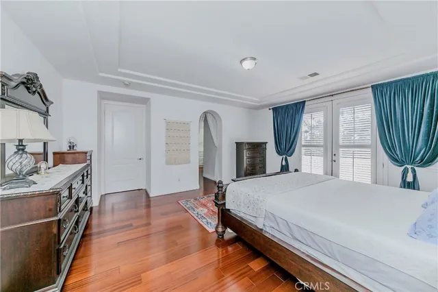 a room with a hardwood floor and a window