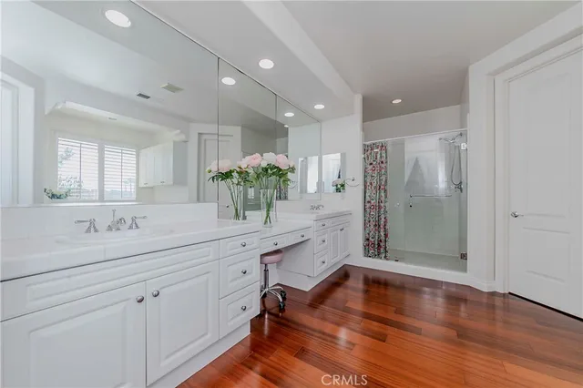 a room with window and white cabinets