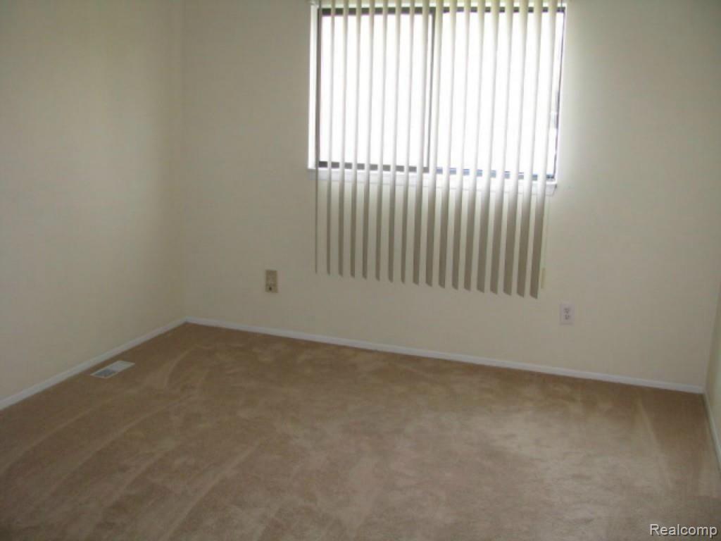 57269 Beaconsfield Road, Unit 34 Washington, MI 48094 - Photo 12 of 18 11. Bedroom 2