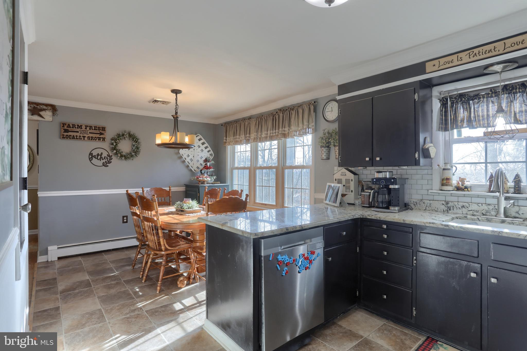 3032 Tunnel Hill Road Lebanon, PA 17046 - Photo 11 of 52 a kitchen with a table chairs and microwave