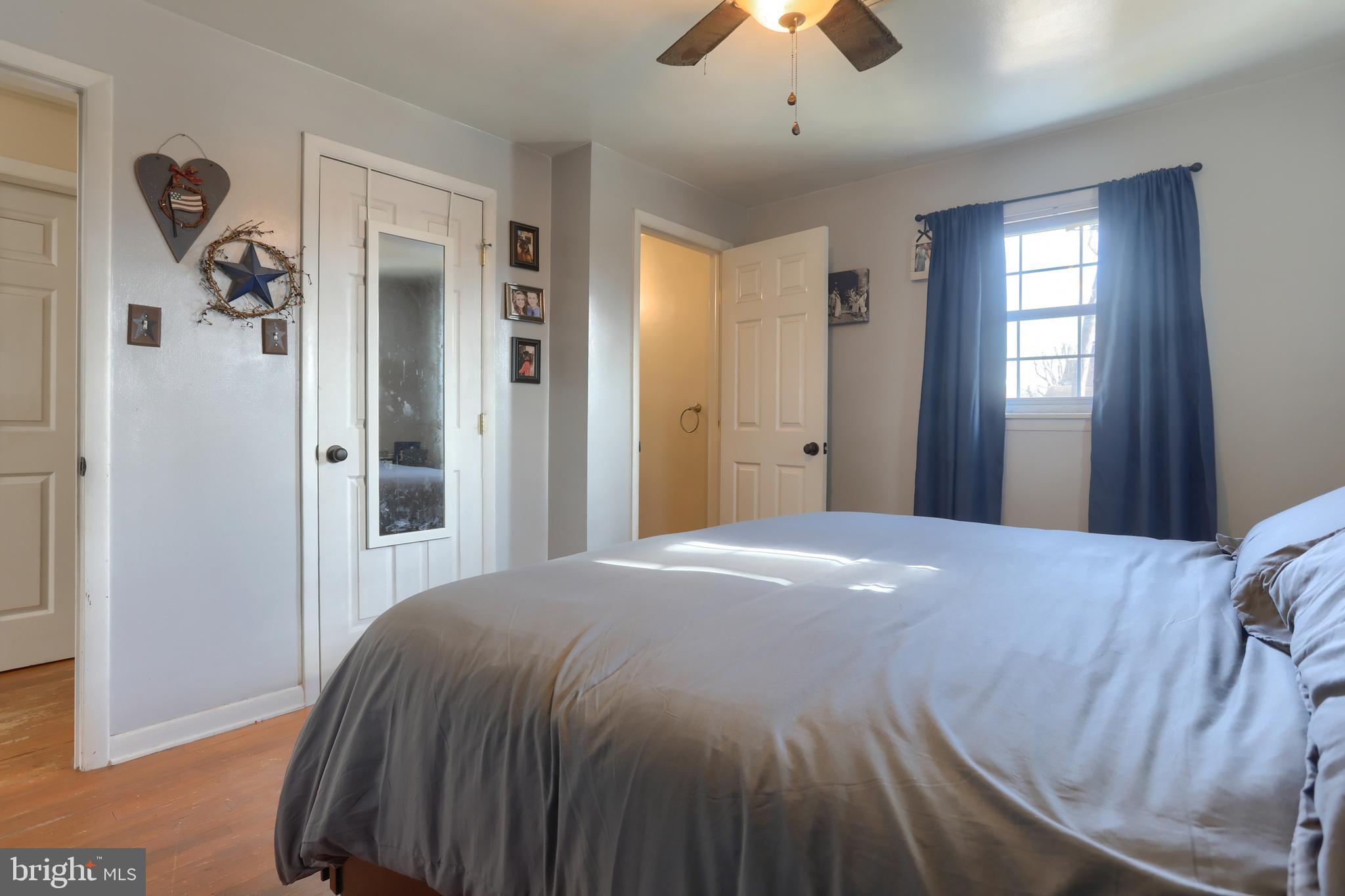 3032 Tunnel Hill Road Lebanon, PA 17046 - Photo 17 of 52 a bedroom with a bed and a chandelier