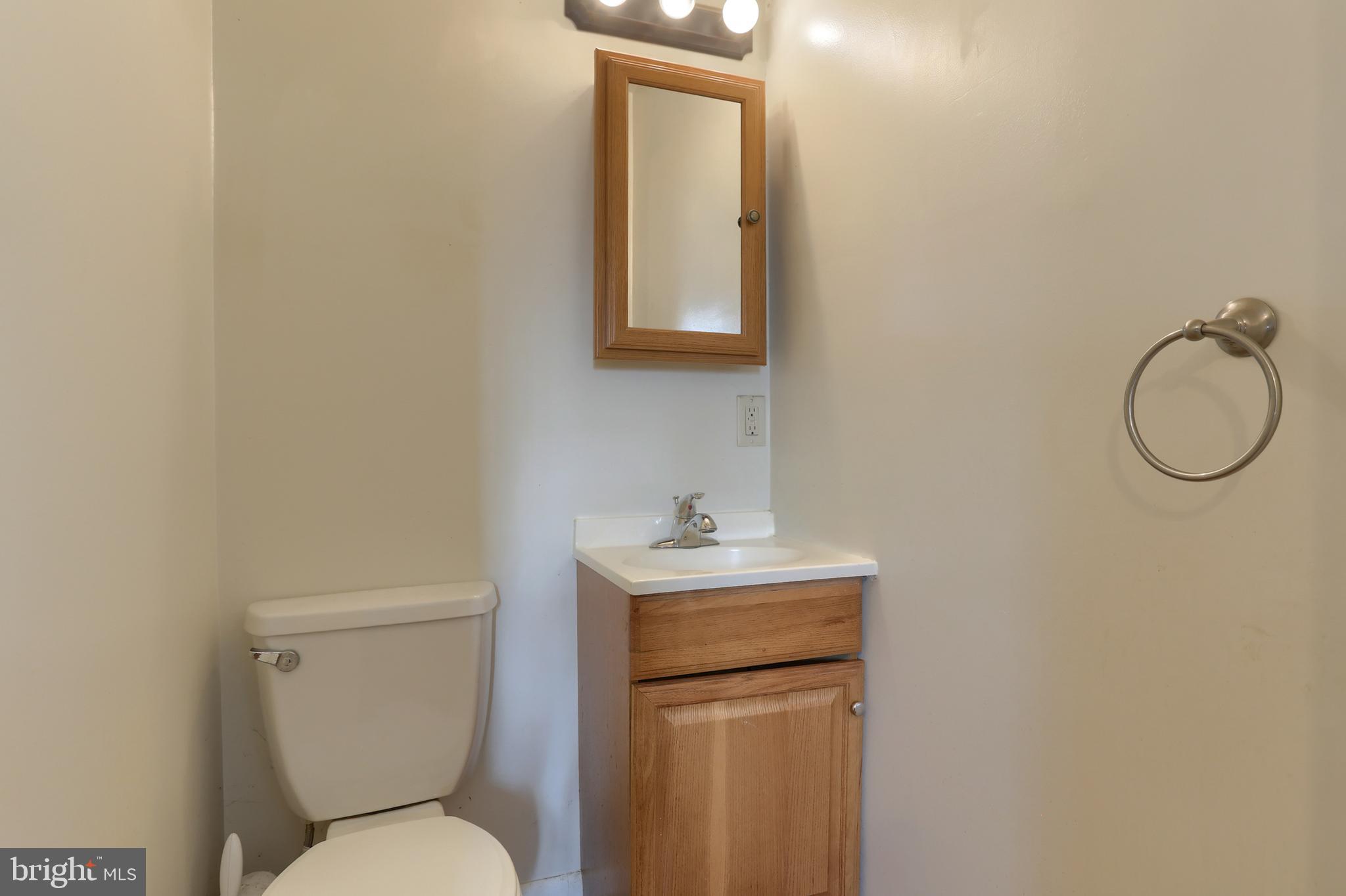 3032 Tunnel Hill Road Lebanon, PA 17046 - Photo 18 of 52 a bathroom with a toilet a sink and mirror
