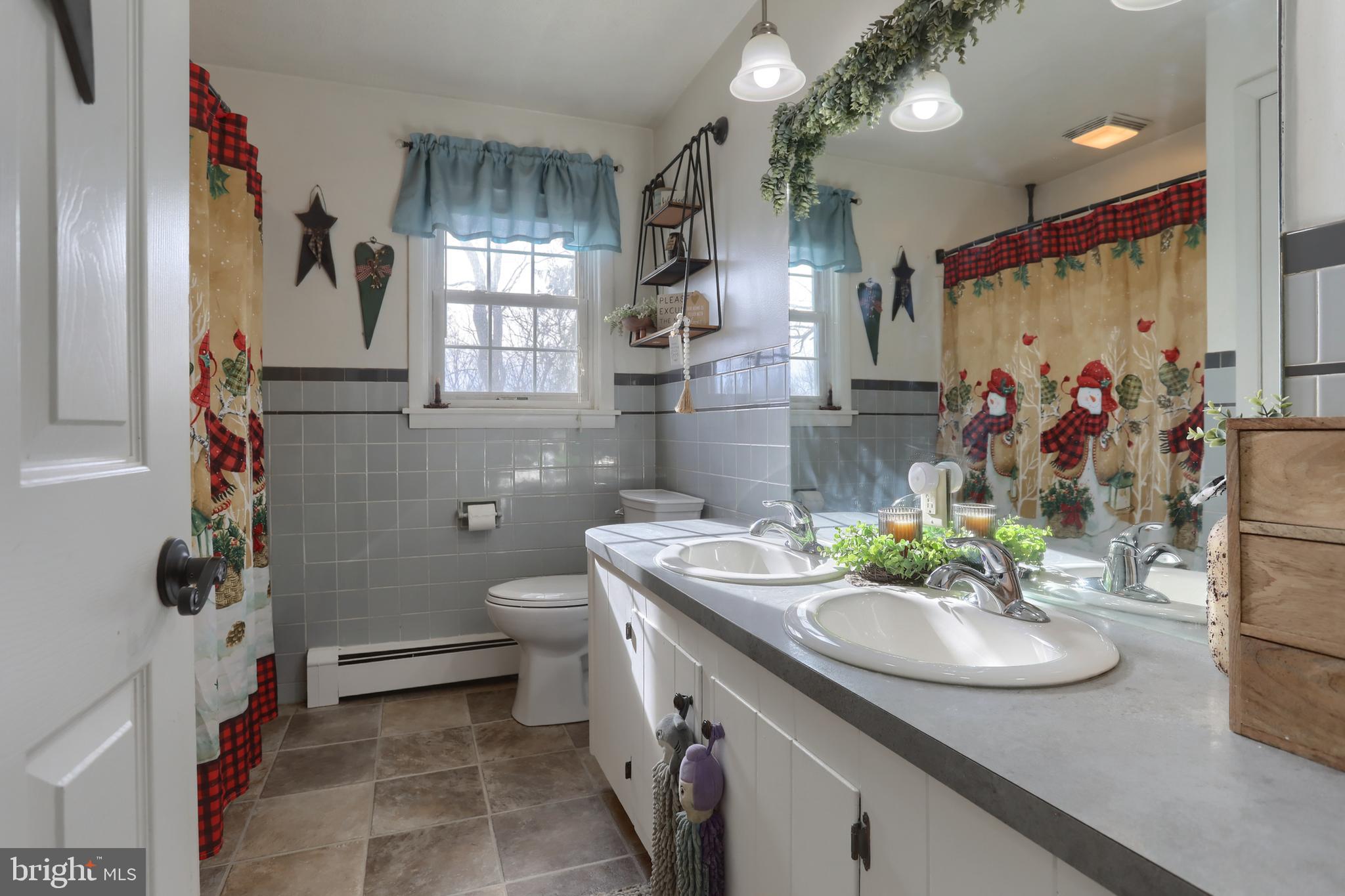 3032 Tunnel Hill Road Lebanon, PA 17046 - Photo 19 of 52 a bathroom with a sink toilet and shower