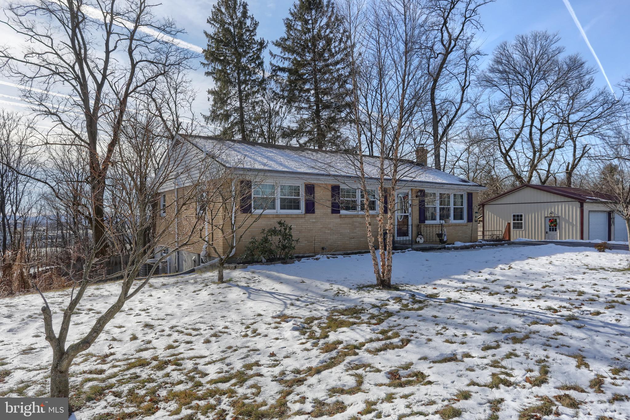 3032 Tunnel Hill Road Lebanon, PA 17046 - Photo 2 of 52 a view of a house with a yard covered with snow in the backyard
