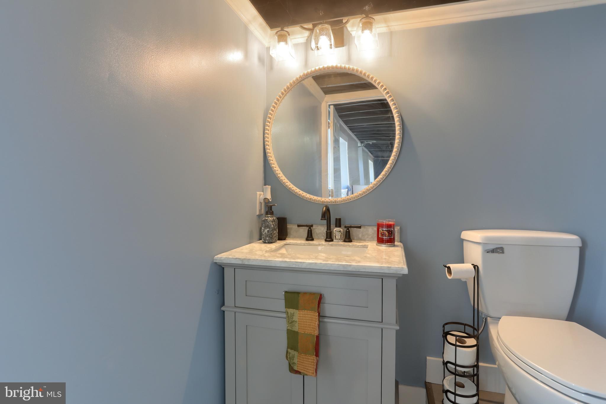 3032 Tunnel Hill Road Lebanon, PA 17046 - Photo 27 of 52 a bathroom with a toilet sink vanity and mirror
