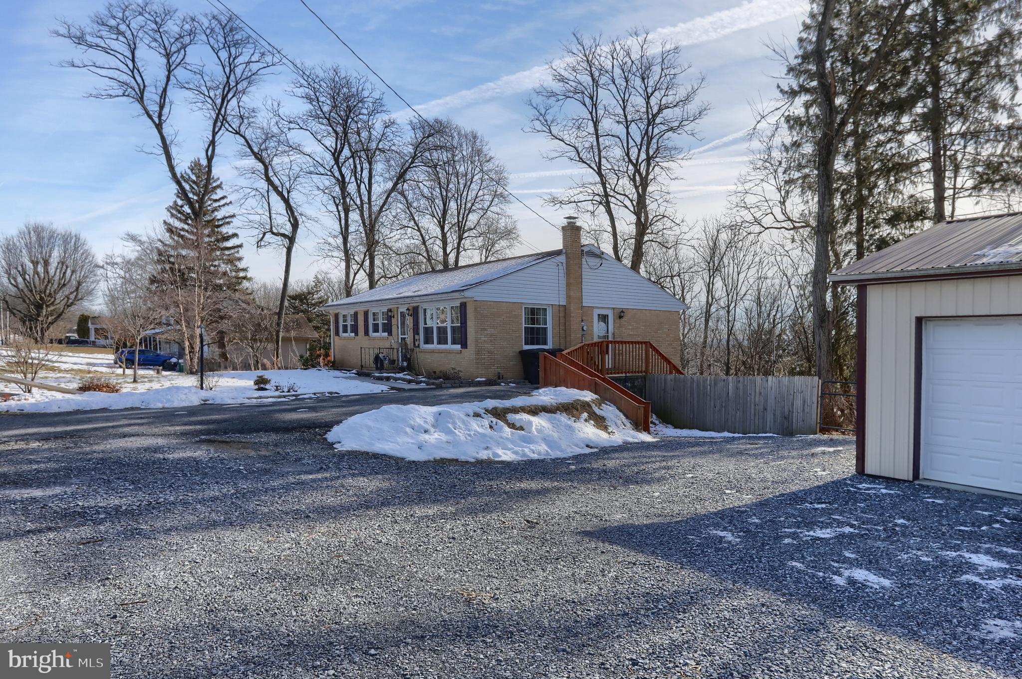 3032 Tunnel Hill Road Lebanon, PA 17046 - Photo 37 of 52 a front view of a house with a yard covered with snow