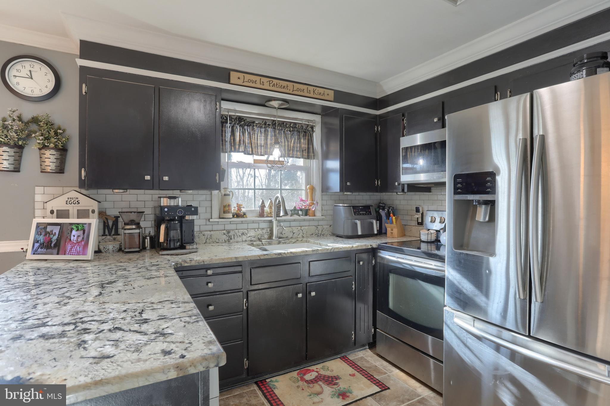 3032 Tunnel Hill Road Lebanon, PA 17046 - Photo 10 of 52 a kitchen with stainless steel appliances granite countertop a sink stove and refrigerator