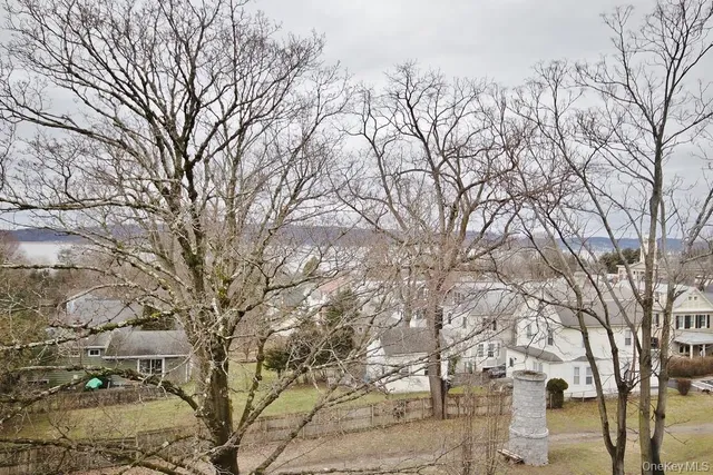 a backyard of a house with large trees