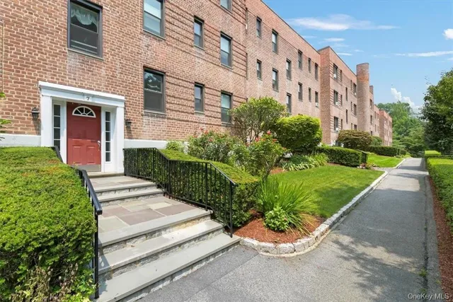 a view of a building with a yard