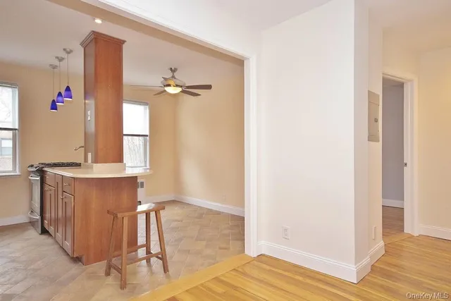 a view of a kitchen from the hallway
