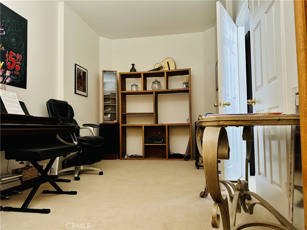 1665 Ravenswood Road Beaumont, CA 92223 - Photo 10 of 41 a view of a workspace with furniture and a window