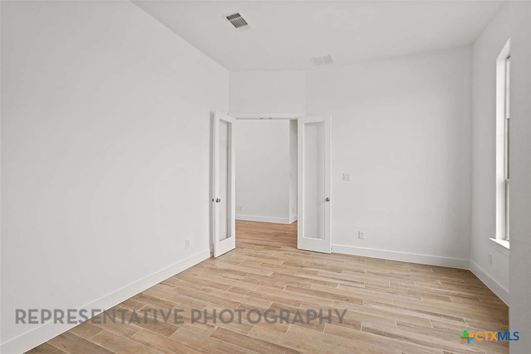 129 Ribera Drive Liberty Hill, TX 78642 - Photo 13 of 23 a view of an empty room