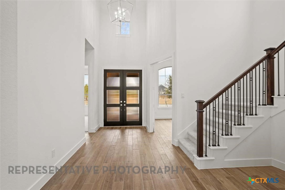 129 Ribera Drive Liberty Hill, TX 78642 - Photo 16 of 23 a view of entryway with wooden floor