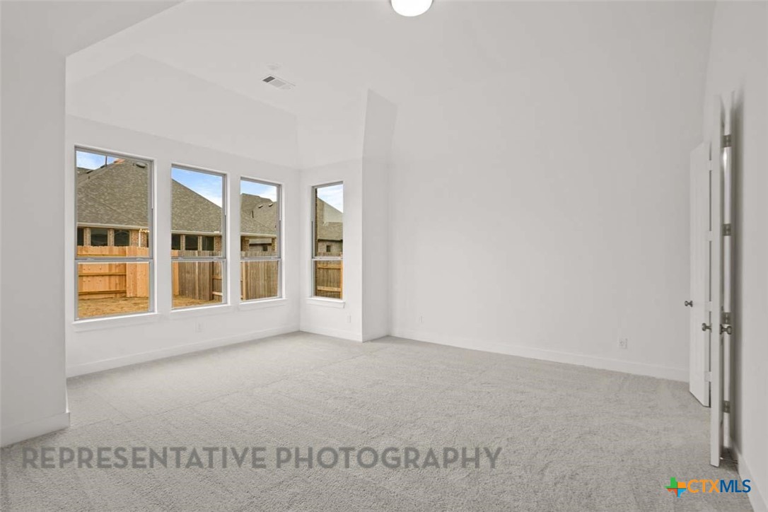 129 Ribera Drive Liberty Hill, TX 78642 - Photo 7 of 23 a view of an empty room with a window