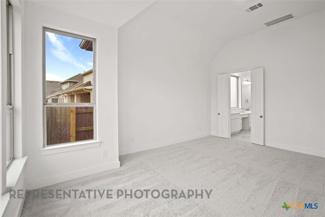 129 Ribera Drive Liberty Hill, TX 78642 - Photo 8 of 23 a view of an empty room and window