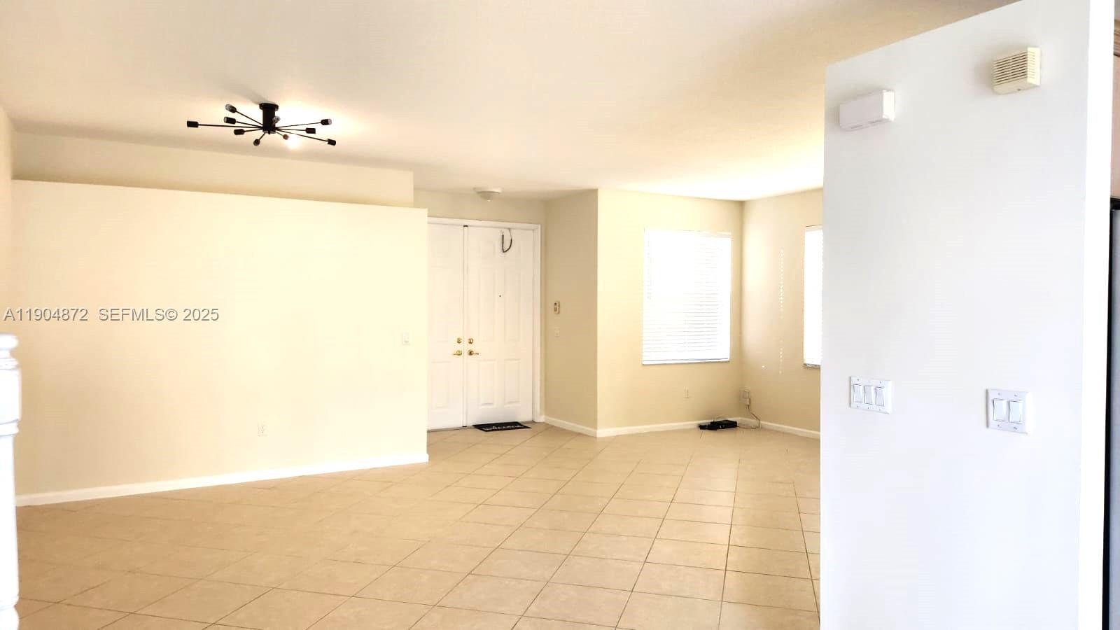 9042 Dupont Place Wellington, FL 33414 - Photo 11 of 43 a view of a room with window