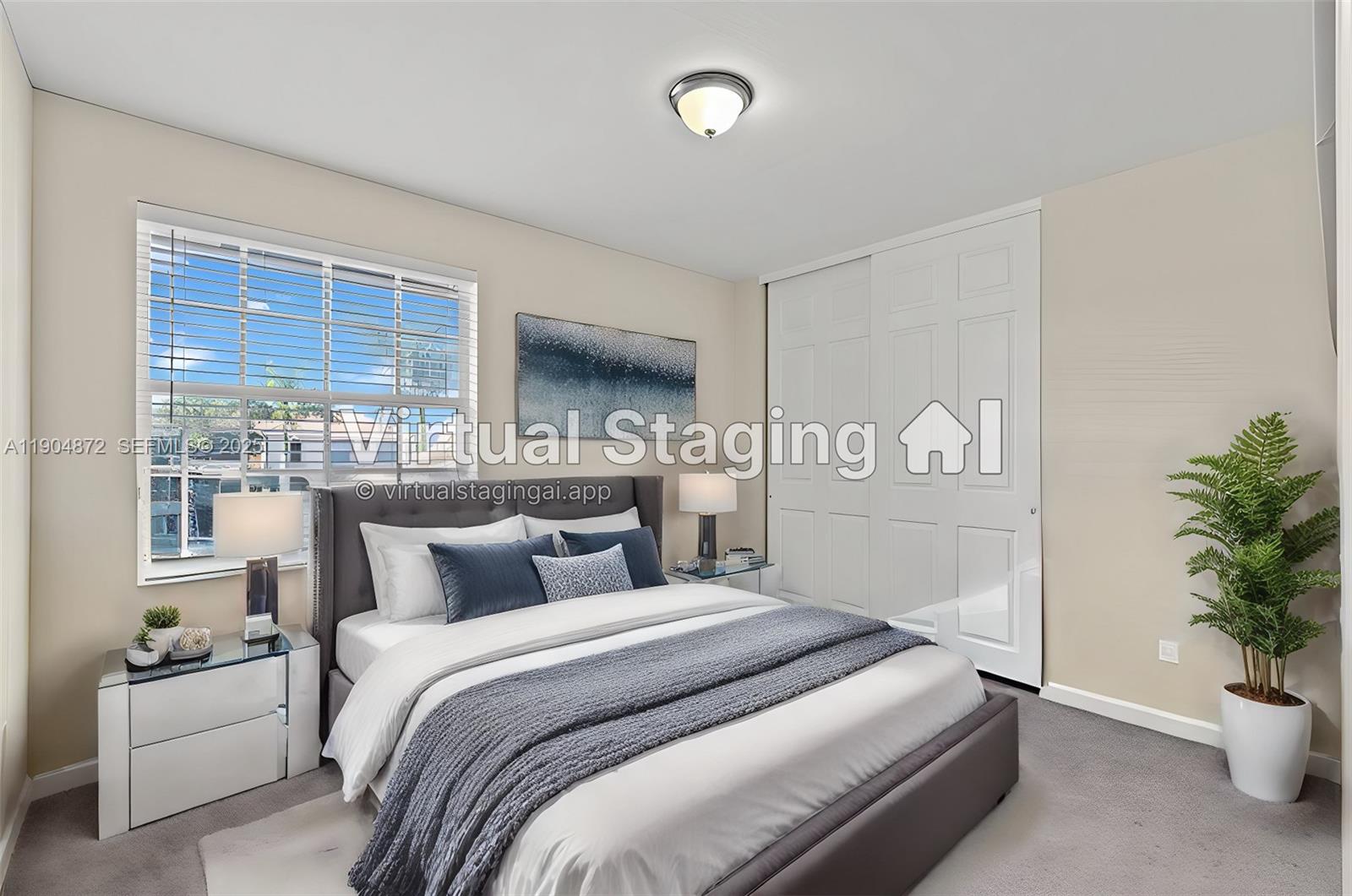 9042 Dupont Place Wellington, FL 33414 - Photo 14 of 43 a bedroom with a large bed and a potted plant