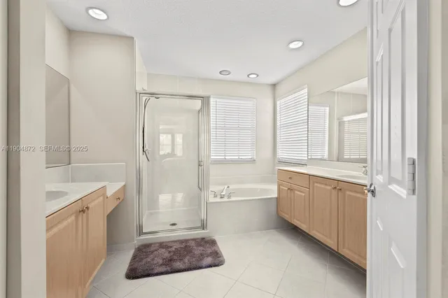 a view of a kitchen with a sink and a window