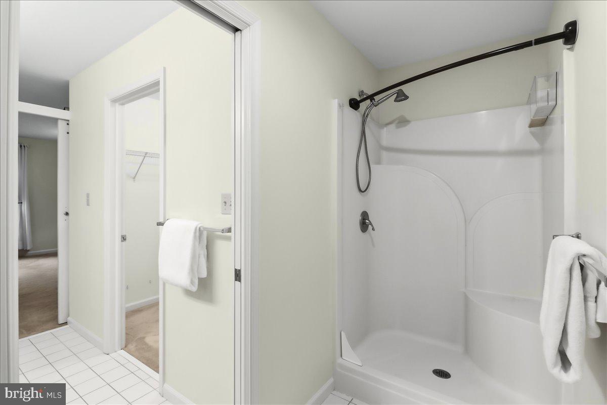 9 Parkside Drive Elverson, PA 19520 - Photo 14 of 33 a bathroom with a glass shower door