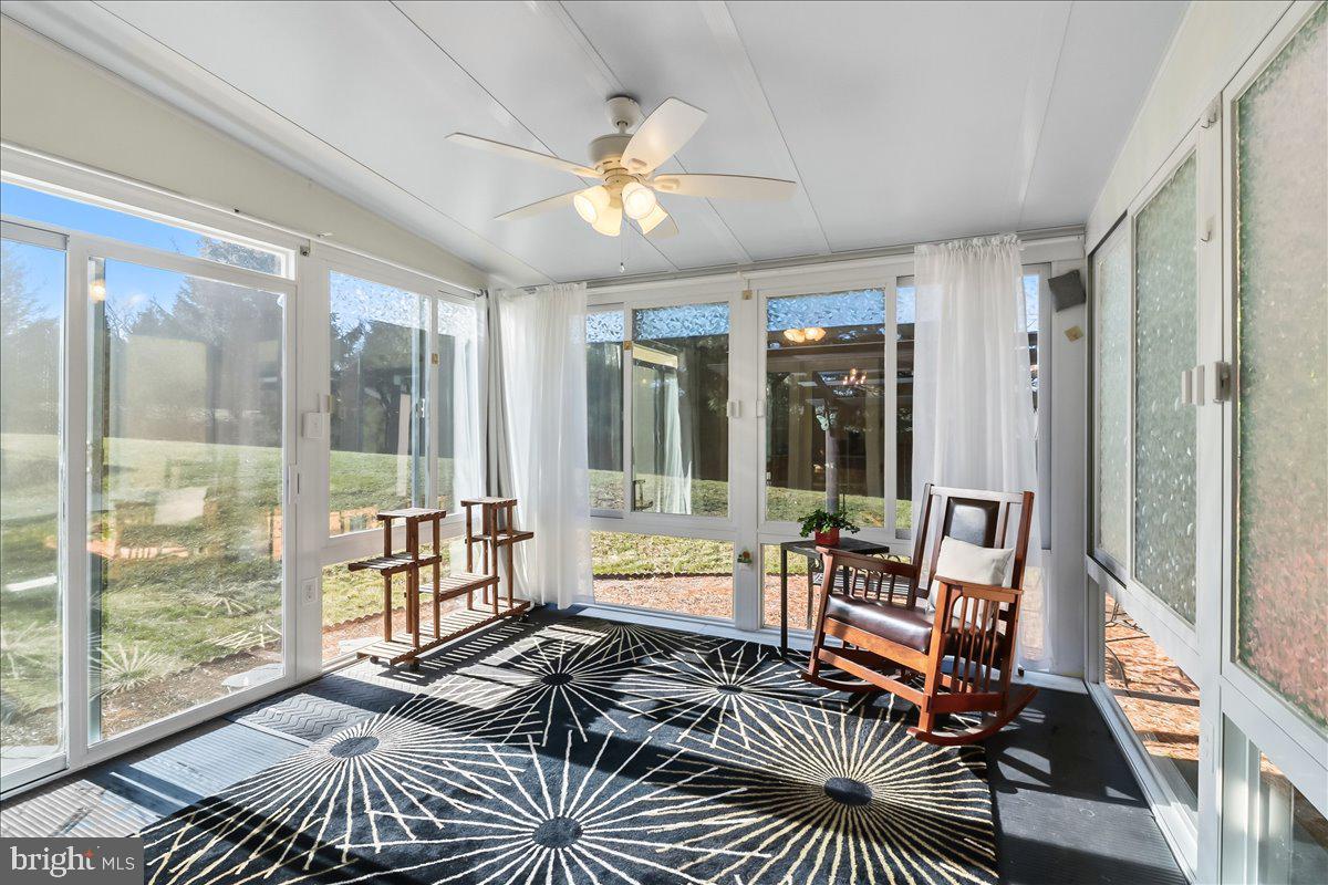 9 Parkside Drive Elverson, PA 19520 - Photo 10 of 33 a living room with furniture and a floor to ceiling window
