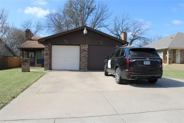 a car parked in front of a house