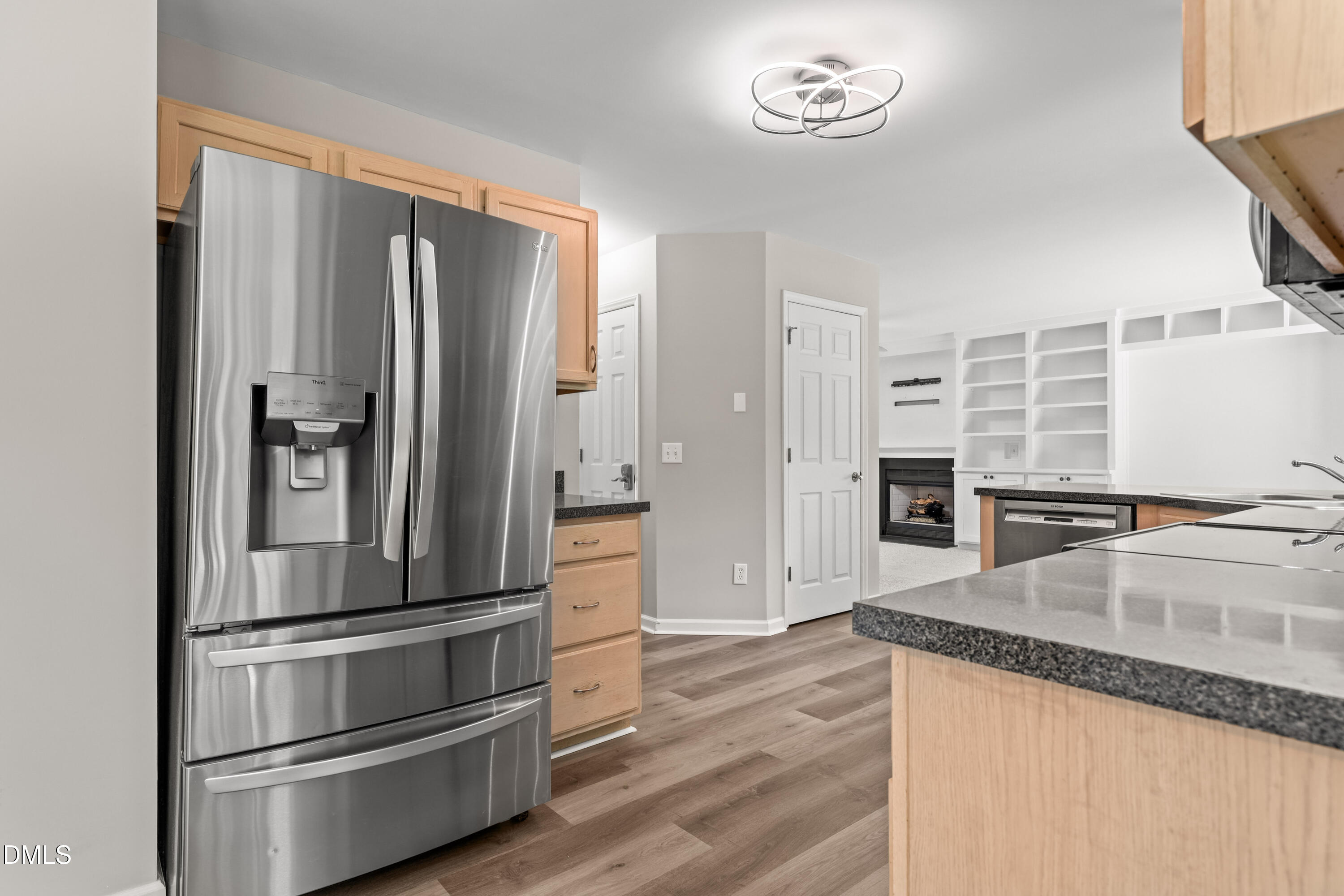 3015 Rennit Court Raleigh, NC 27603 - Photo 14 of 40 a kitchen with granite countertop a refrigerator and a stove