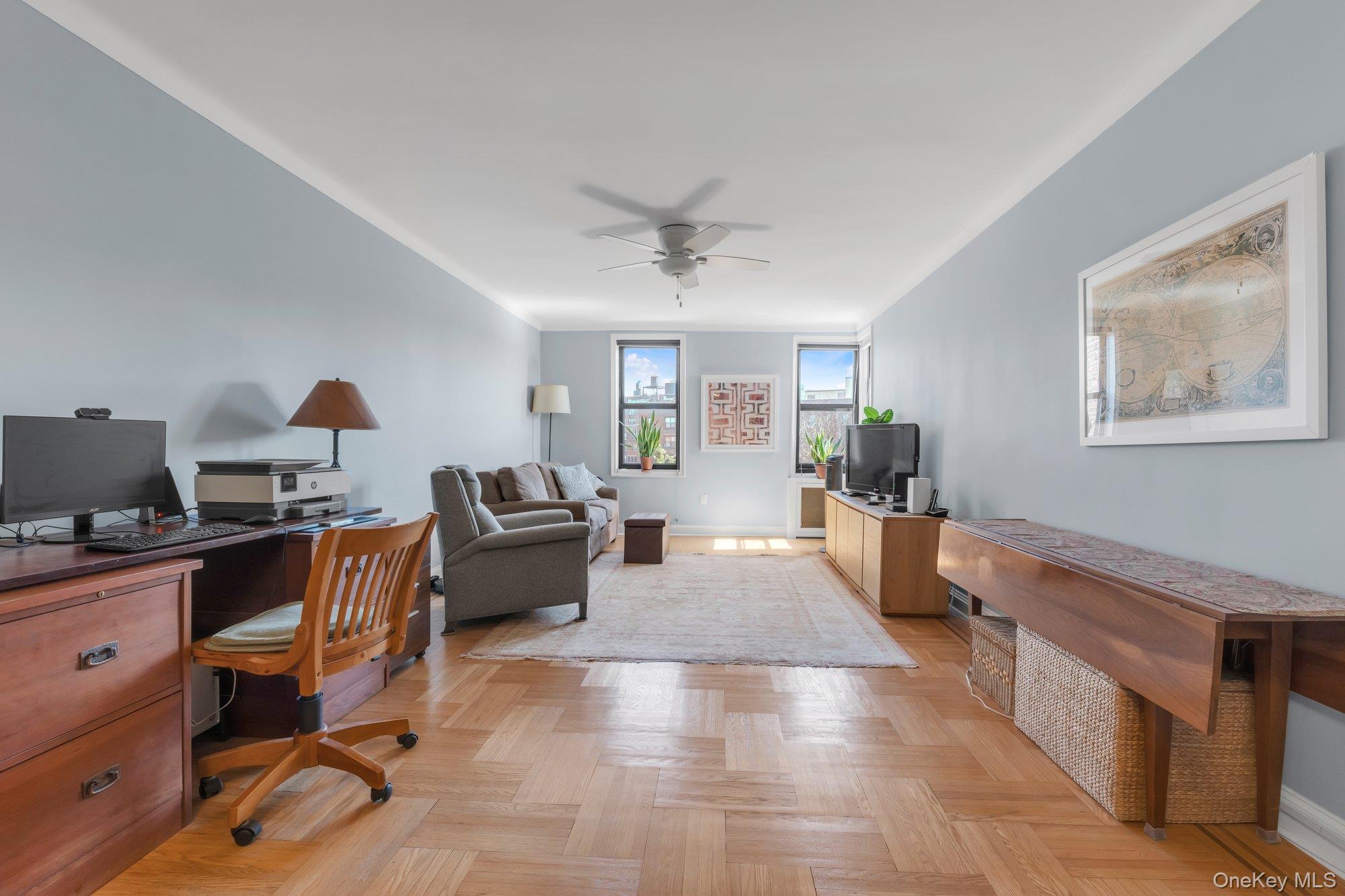 84-51 Beverly Road, Unit 6A Queens, NY 11415 - Photo 4 of 14 a living room with furniture and a wooden floor