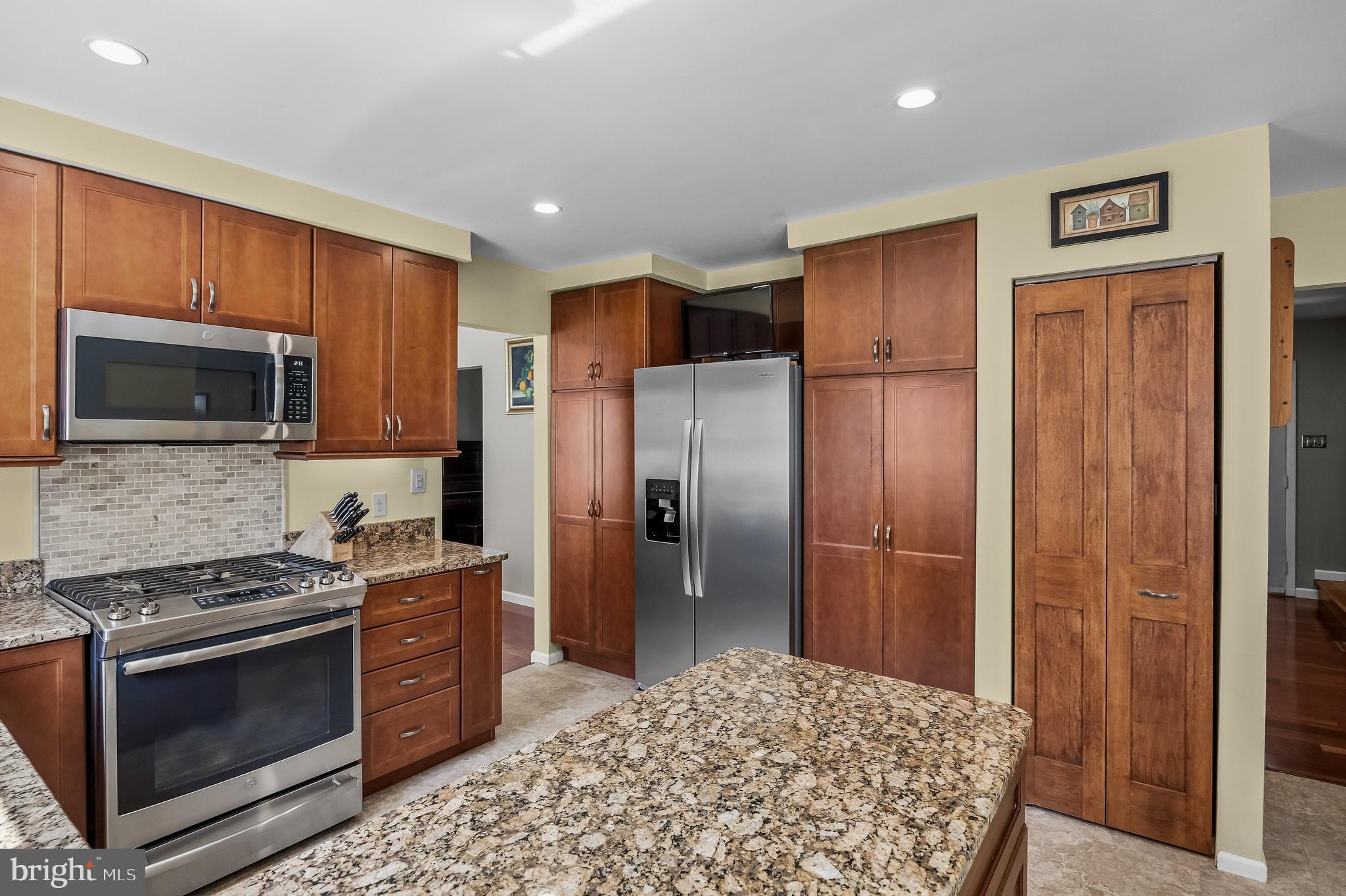 446 Prospect Avenue West Berlin, NJ 08091 - Photo 14 of 54 a kitchen with stainless steel appliances granite countertop a refrigerator and a stove top oven