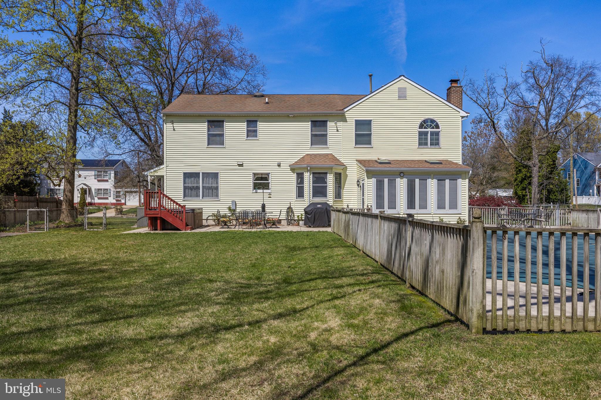 446 Prospect Avenue West Berlin, NJ 08091 - Photo 35 of 54 a view of a white house with a yard deck and a large tree