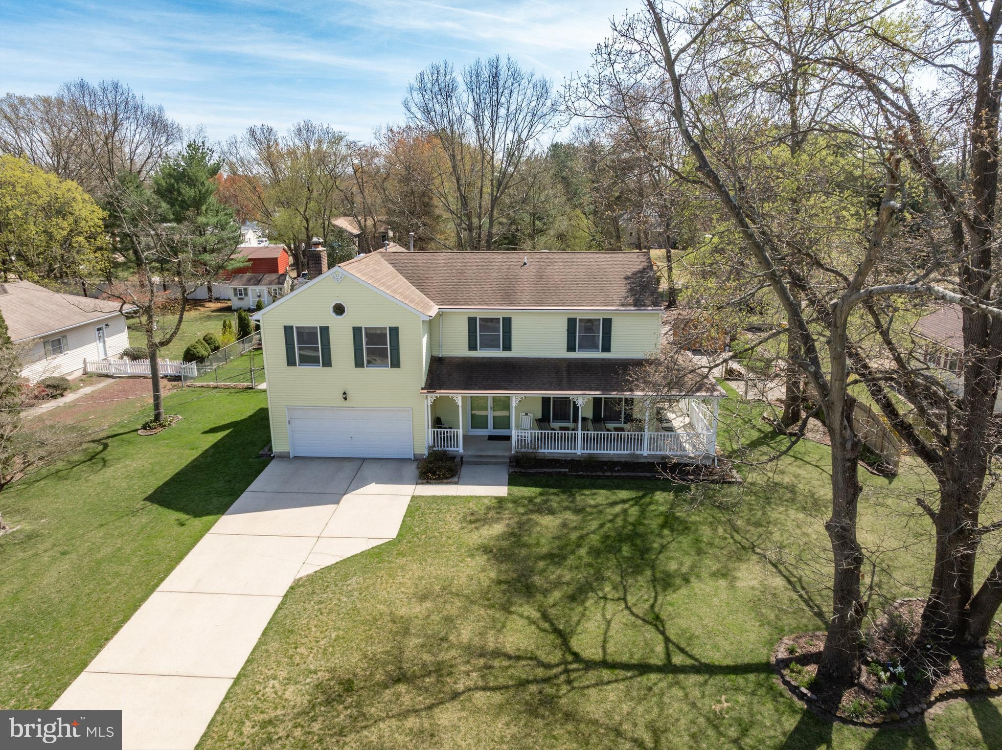 446 Prospect Avenue West Berlin, NJ 08091 - Photo 42 of 54 a front view of a house with a yard and trees