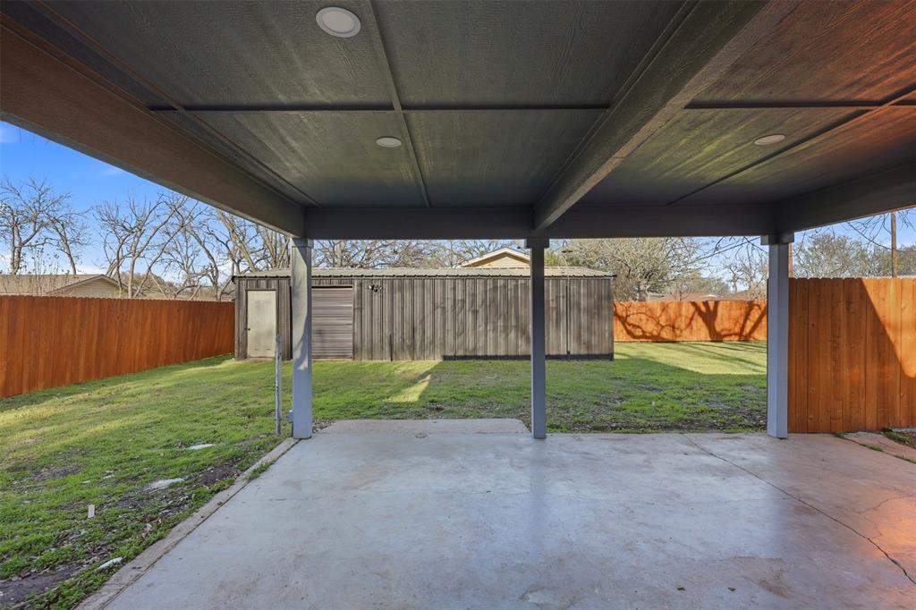 502 Madison Street Cleburne, TX 76033 - Photo 23 of 30 a view of backyard and porch