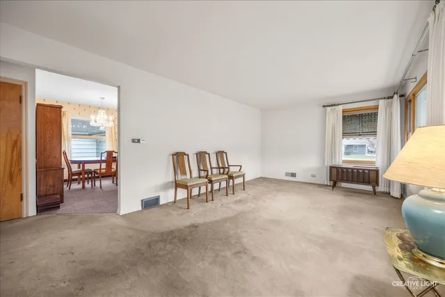a view of a livingroom with furniture and a window