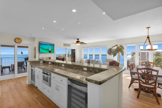 a kitchen with stainless steel appliances granite countertop a sink and a stove