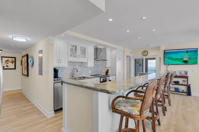 a view of a hallway with washer and dryer