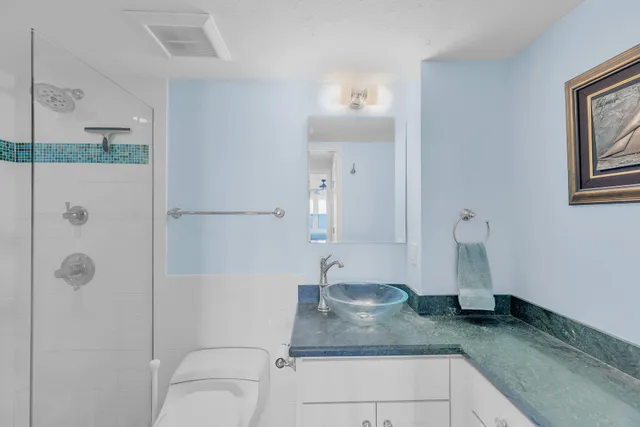 a view of a hallway with wooden floor and windows
