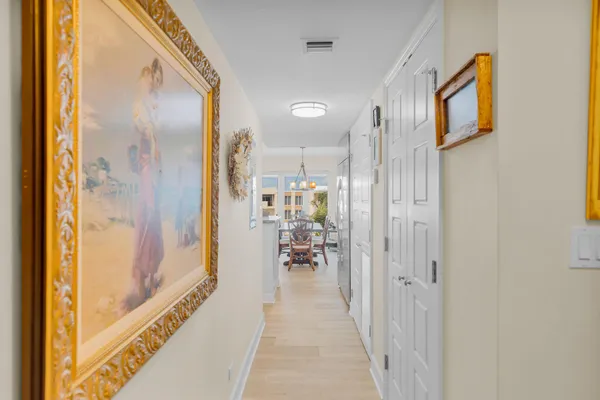 a bedroom with a bed and chandelier