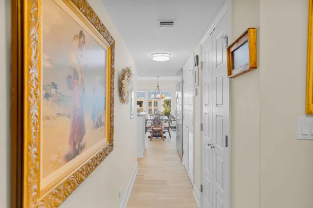 a bedroom with a bed and chandelier