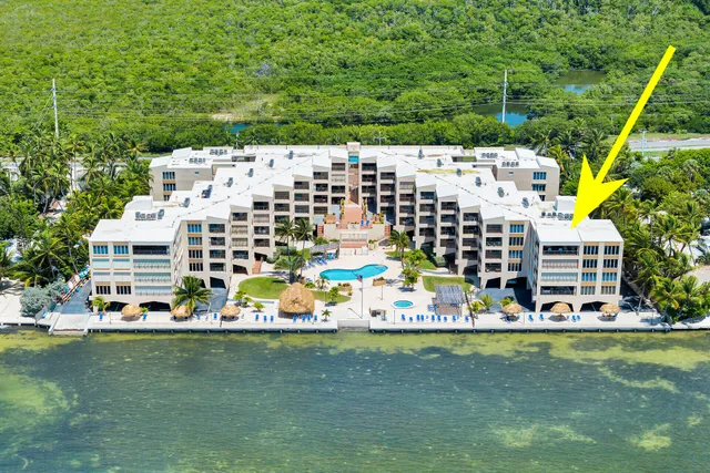 a view of a swimming pool with outdoor seating