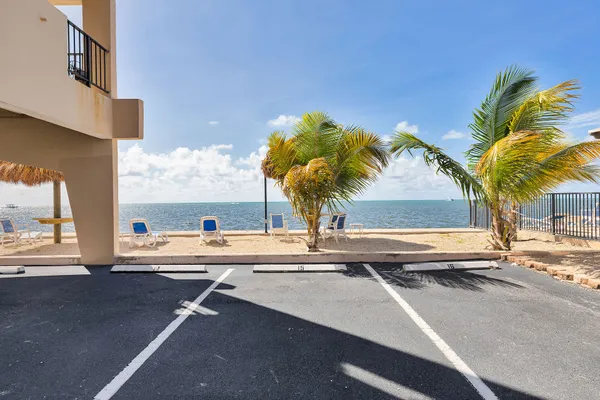 a swimming pool with outdoor seating and yard