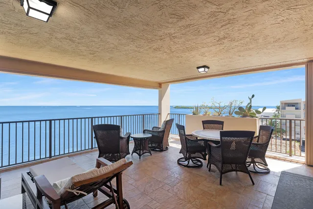 a view of building with potted plants
