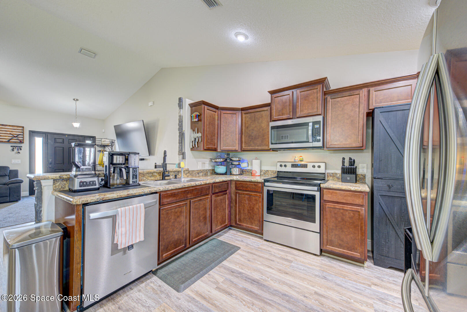 6165 Adina Road Cocoa, FL 32927 - Photo 15 of 32 kitchen with vaulted ceilings