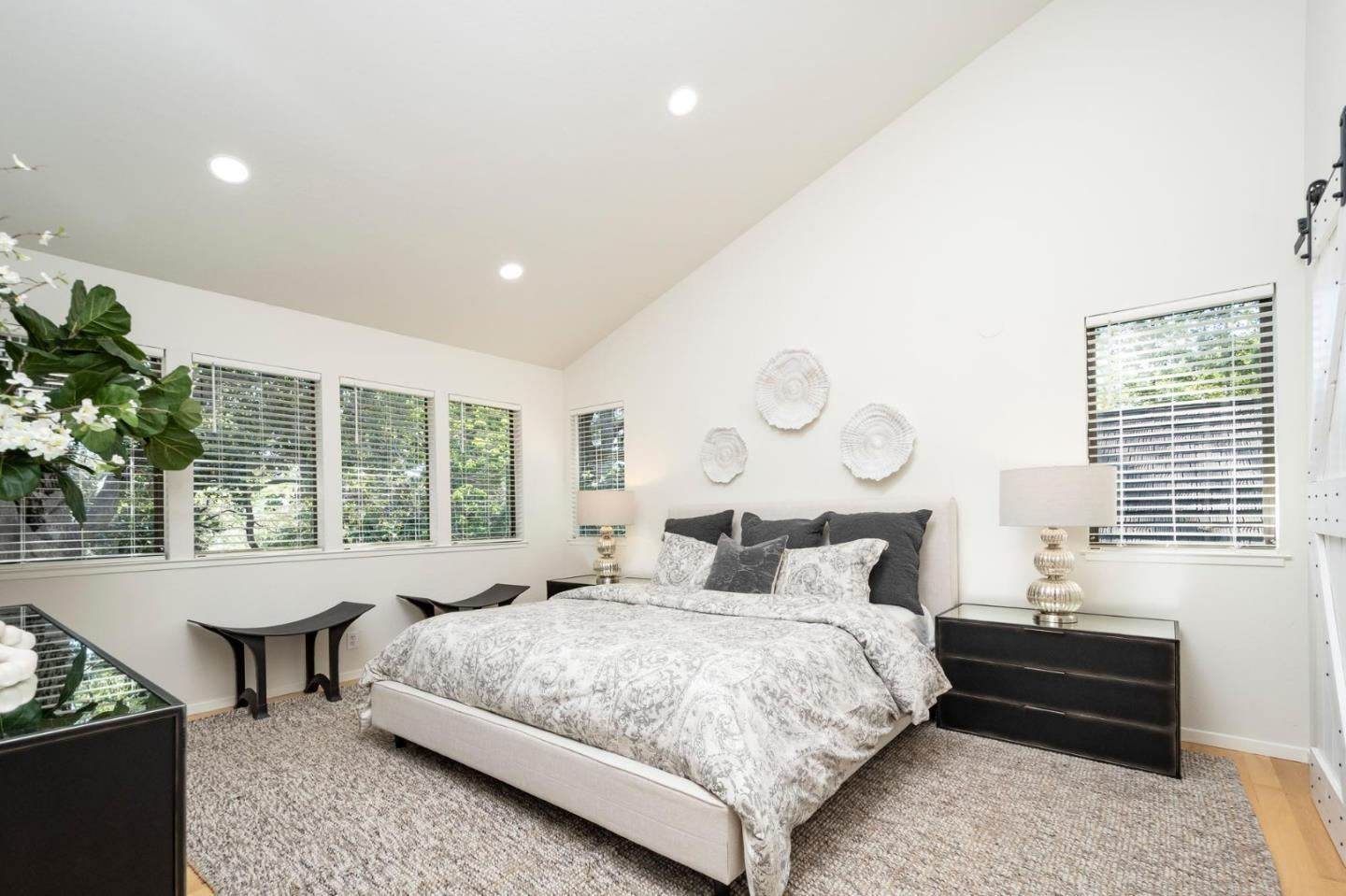 2499 Alpine Road Menlo Park, CA 94025 - Photo 14 of 28 a bedroom with a large bed and a potted plant