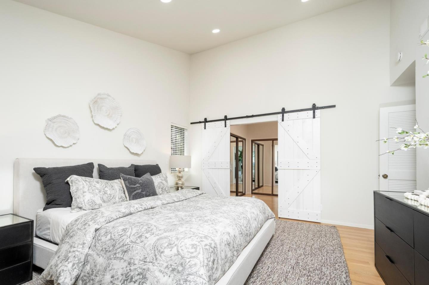 2499 Alpine Road Menlo Park, CA 94025 - Photo 15 of 28 a spacious bedroom with a bed and a chandelier