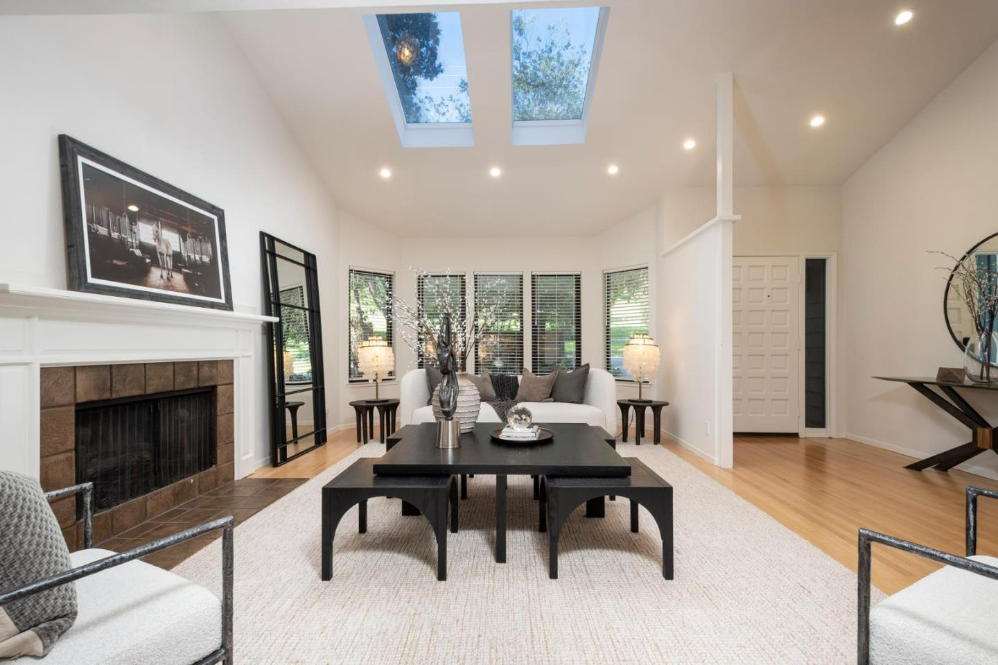2499 Alpine Road Menlo Park, CA 94025 - Photo 2 of 28 a living room with furniture a fireplace and a table
