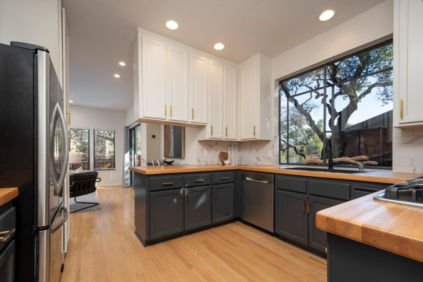 2499 Alpine Road Menlo Park, CA 94025 - Photo 7 of 28 a kitchen with stainless steel appliances granite countertop a sink stove and refrigerator