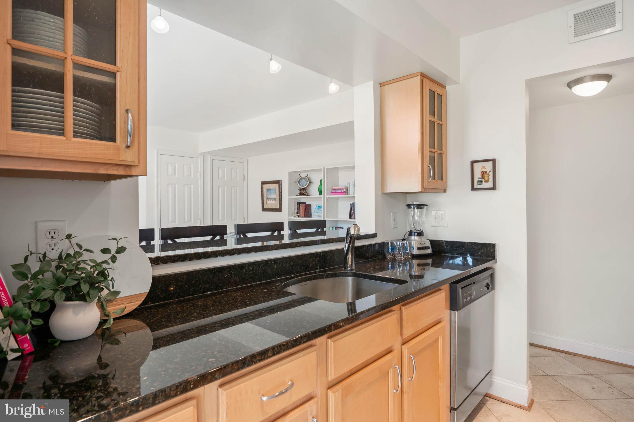 13908 North Ocean Road, Unit 10A Ocean City, MD 21842 - Photo 7 of 29 a kitchen with a sink and cabinets
