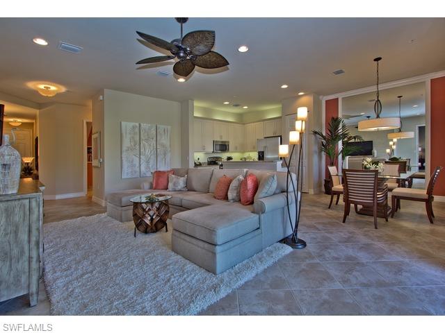 6545 Monterey Point Naples, FL 34105 - Photo 1 of 10 a living room with furniture and a chandelier