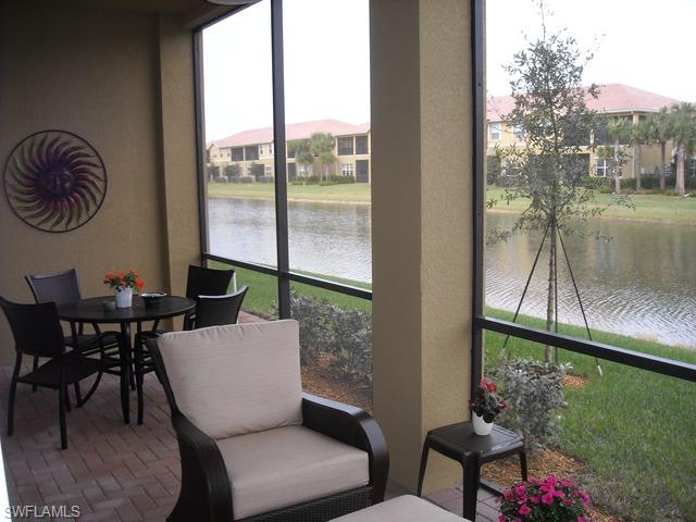 6545 Monterey Point Naples, FL 34105 - Photo 5 of 10 a dining room with furniture and a floor to ceiling window