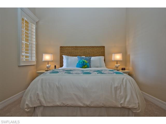 6545 Monterey Point Naples, FL 34105 - Photo 8 of 10 a bedroom with a bed and window