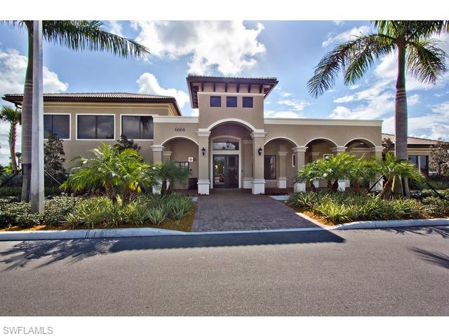 6545 Monterey Point Naples, FL 34105 - Photo 9 of 10 a front view of a house with a garden